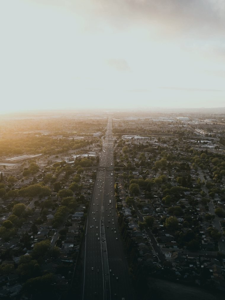 Aerial view of a city road corridor at sunset